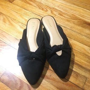 Black faux suede slip ons